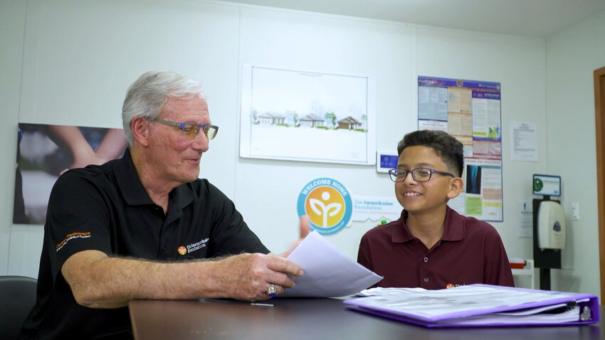 Middle school student receives career guidance from Immokalee Foundation career counselor Mr. Kent