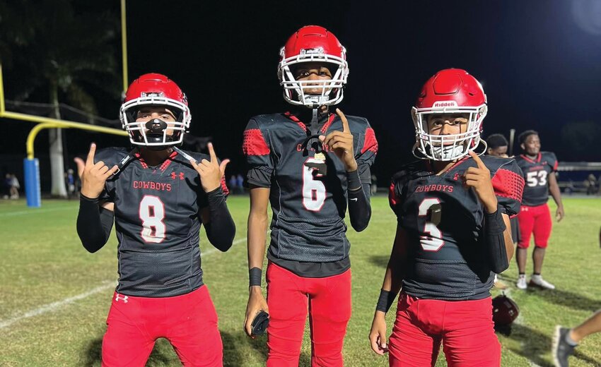 Epifanio Hernandez, Steaver Moore, and Aldrich Meyer pose for a pictures following their 33-0 win over Canterbury. [Photo courtesy LHS Athletics]