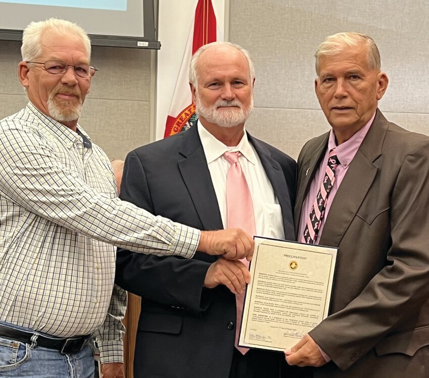 OKEECHOBEE &ndash; At their Oct. 17 meeting, Okeechobee County Commissioners declared Oct. 25 to Nov. 2 at Florida Department of Transportation Mobility Week. Okeechobee County Public Works Director Darren Brown (left) and County Engineer Stef Matthes (center) accepted the proclamation from Commission Chair David Hazellief. Mobility Week is a cooperative effort by the Florida Department of Transportation and its partner agencies to promote awareness of safe, multimodal transportation choices by hosting an annual collection of outreach events. It is a time for counties, cities, and transportation agencies to highlight transportation achievements, roll out new initiatives, and/or implement new policies promoting multimodal transportation. [Photo by Katrina Elsken/Lake Okeechobee News]