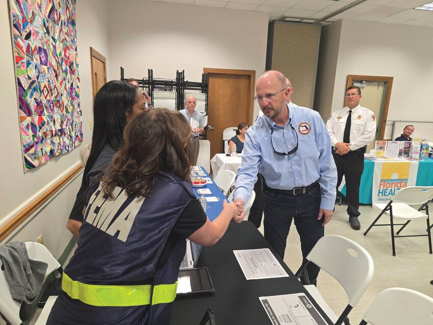 OKEECHOBEE -- On Oct. 24, Okeechobee County welcomed the Executive Director of the Florida Division of Emergency Management to the Multi-Agency Resource Center (MARC) at the Okeechobee County Library. Director Kevin Guthrie toured the center, greeted agencies represented in the MARC and thanked staff before having an opportunity to spend some time meeting with our Public Safety Director/Fire Chief Earl Wooten, Deputy Chief Justin Hazellief and other local representatives.   Director Guthrie offered his support to make sure Okeechobee residents are getting the resources they need during our long term recovery efforts.  The Multi-Agency Resource Center at the Okeechobee County Library will continue to be open Tuesday through Saturday from 10:30 a.m.-5:30 p.m. Several agencies are represented including FEMA,  Hope Florida, the Department of Business and Professional Regulations, and Catholic Charities.