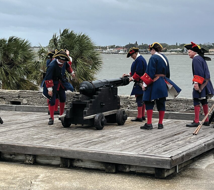 ST AUGUSTINE -- Park personell and volunteers dress in period costume to fire a cannon at Castillio de San Marcos. [Photo by Katrina Elsken/Lake Okeechobee News]