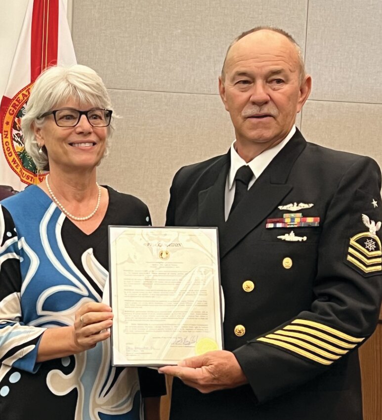 OKEECHOBEE -- Okeechobee County Commissioner Kelly Owens (left) presented the Operation Green Light proclamation to Veterans Services Officer Paul Hiott at the Nov. 7 meeting of the Okeechobee County Commission. [Photo by Katrina Elsken/Lake Okeechobee News]