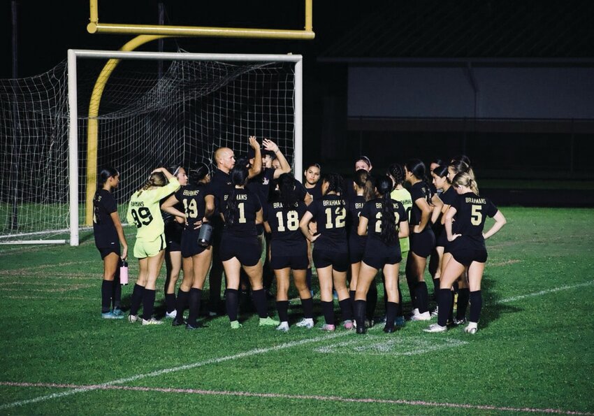 The Lady Brahmans huddle up following a game. [Photo courtesy OHS Lady Brahman soccer]