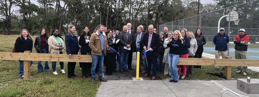 OKEECHOBEE -- Okeechobee County Commissioners officiated at the ribbon cutting for the new fitness trail at the Darrell Enfinger Sports Complex on Jan. 23. [Photo by Katrina Elsken/Lake Okeechobee News]