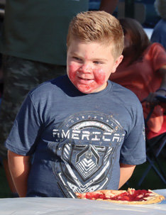 Maddix Kendrick, winner of the youth division of the pie eating contest.