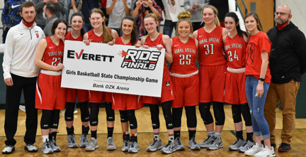 The Rural Special senior girls basketball team post with their "ticket" to the Class 1A Championship.