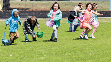 Mountain View kindergartners run to find eggs on the football field during an Easter egg hunt April 2.