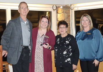 Jim and Sandy Qualls, with Executive Director Rianna Kendrick (second from left) and President Michelle Atchison (right)..
