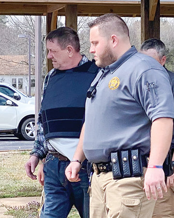 Nathaniel Freeman is escorted from the Stone County Court Complex in Mountain View March 18 at the conclusion of the trial.