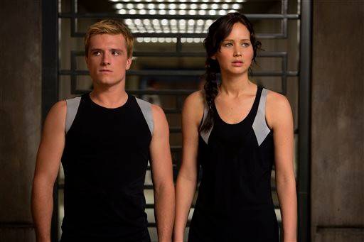 Josh Hutcherson as Peeta Mellark, left, and Jennifer Lawrence as Katniss Everdeen are shown in a scene from &quot;The Hunger Games: Catching Fire&quot; which premiered in 2013. Suzanne Collins new book in the series, &quot;Sunrise on the Reaping&quot; will be published March 18, 2025, with a film by the same name opening in theaters on Nov. 20, 2026.