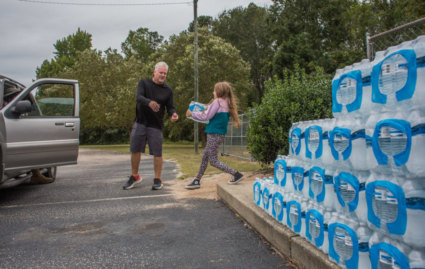 Palmetto Oyster House hands out free water to locals before Hurricane Ian hits Sumter in 2022.