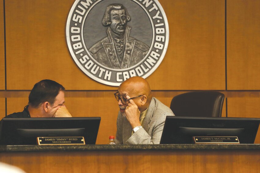 Councilman Jimmy Byrd speaks with Sumter County Council Chairman Jim McCain during a 2023 meeting.
