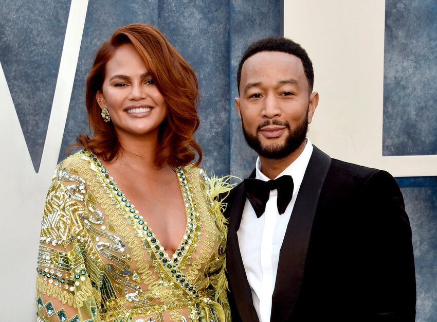 Chrissy Teigen, left, and John Legend arrive at the Vanity Fair Oscar Party in Beverly Hills, California, on March 12, 2023.