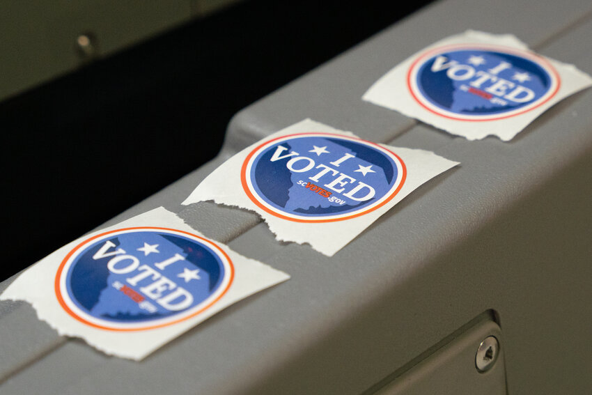 Stickers are arrayed for voters during the South Carolina Republican primary on Saturday, Feb. 24.