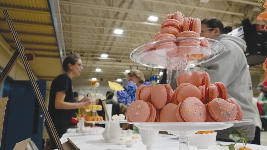 Macarons are displayed at a vendor's booth during last year's Farm to Table event for guests to try. The annual event benefits local nonprofits and will be held this year on Thursday, March 14.