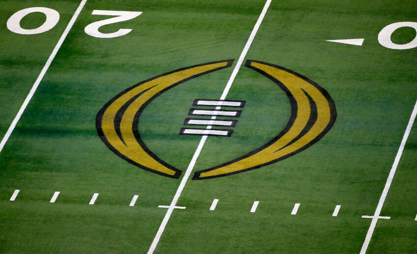 The College Football Playoff logo is shown on the field at AT&amp;T Stadium.