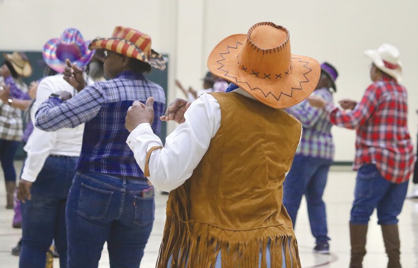 Sumterites line dance at North HOPE Center in Sumter on Friday, March 22, for the Western Women's Workshop celebrating Women's History Month. Line dancing is held at the center every Friday at 8 a.m.