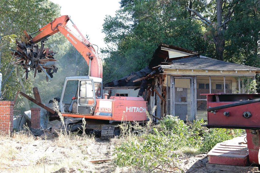 An excavator is used to tear down a dilapidated home at 10 Brent St.on Oct. 10, 2019, as part of a Community Development Block Grant awarded to Sumter County by the S.C. Department of Commerce. The city is in the process of using more grant money to tear down dozens of abandoned homes, mainly in south Sumter.