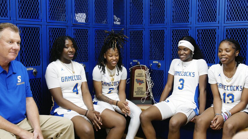 From left, Sumter High head coach Jeff Schaffer sits with Rickell Brown, Keziyah Sanders, Kiara Croskey and Araina Ross as they reflect on their championship season on Wednesday, April 17.