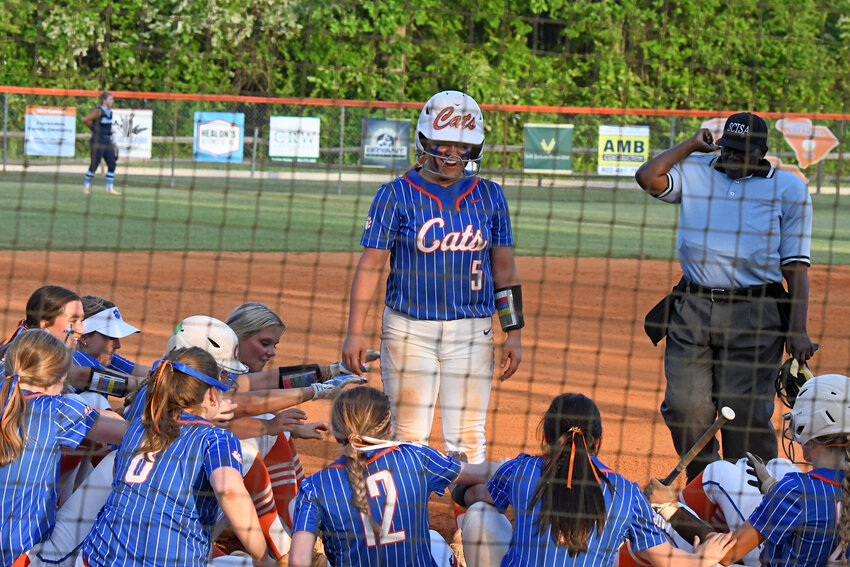 The Laurence Manning softball team celebrates a home run by Karly Bjork, center, on Friday against Wilson Hall.
