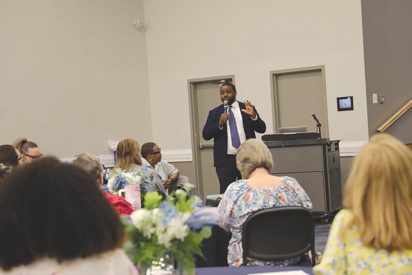 Austin Floyd, who worked for Central Carolina Technical College from 2012 to 2018, speaks to the college's new class of 13 Leadership Academy graduates during a graduation ceremony for the program on Friday, April 19.