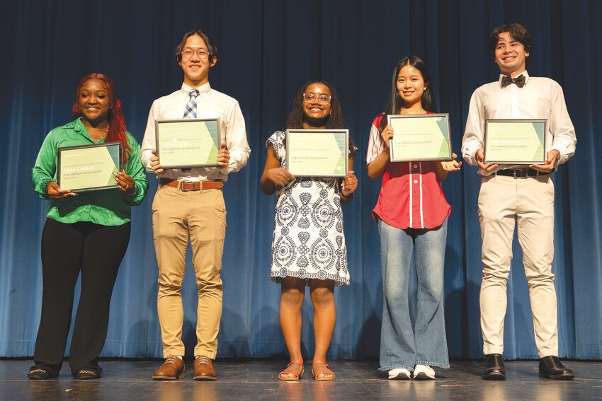 Harmon Scholarship recipients from Sumter High School take part in a surprise ceremony on Monday. Scholarship winners are, from left, Jada Collins, Aiden Kim, Alana Garrick, Erin Lin and Olin Towery.