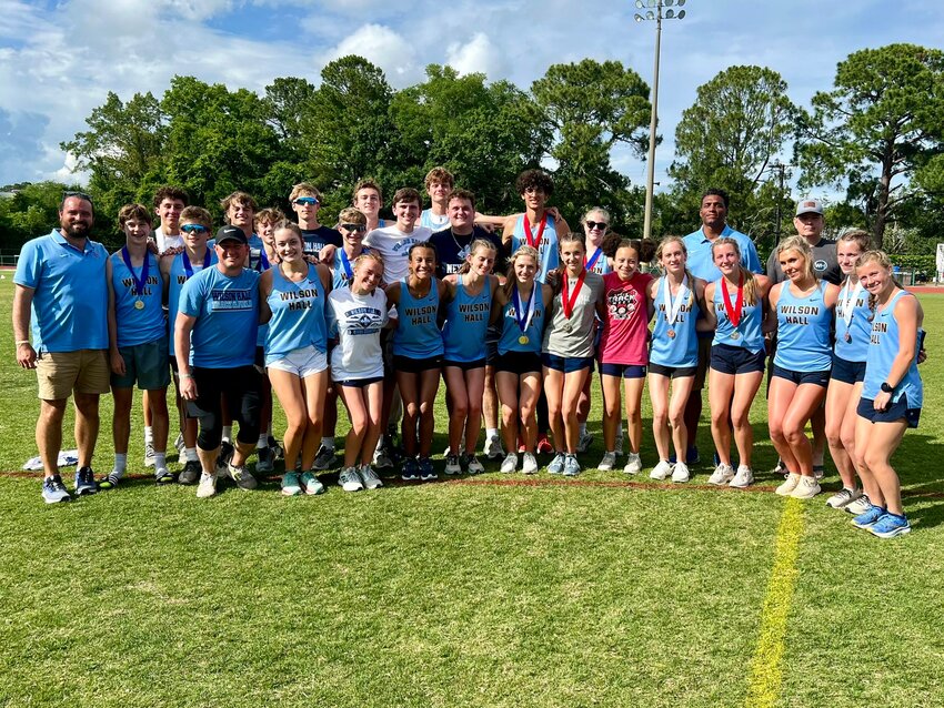 The Wilson Hall track team gathers for a photo after the SCISA Division I state meet on Saturday at Porter-Gaud.