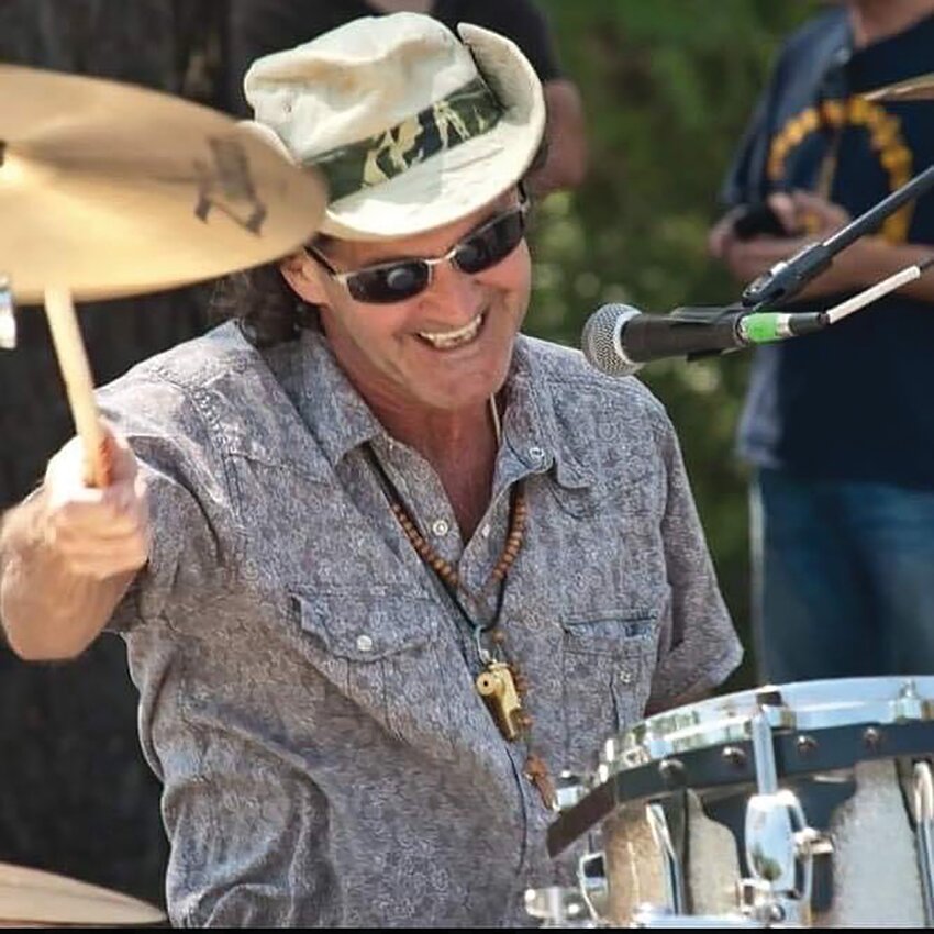 Brooks Wilkinson drums with a smile. He died in April at 66.