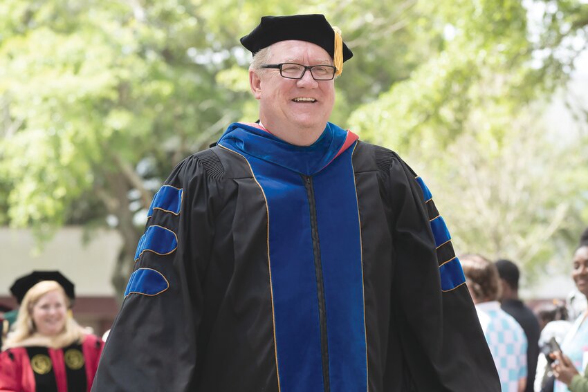 Michael E. Sonntag, University of South Carolina Sumter dean, walks on the University of South Carolina Sumter grounds during the university's 2024 commencement ceremony on May 1.