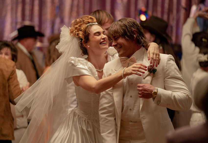 This image released by A24 shows Lily James, left, and Zac Efron in a scene from &quot;The Iron Claw.&quot;