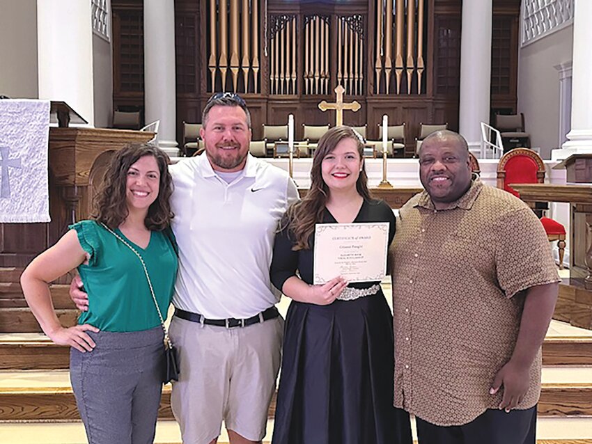 Giianni Faught, center, is a junior at Sumter High School and was awarded the Elizabeth Book Vocal Scholarship, sponsored by Woman's Afternoon Music Club. Faught is joined by her parents, left, and choir teacher Herbert Johnson, right.