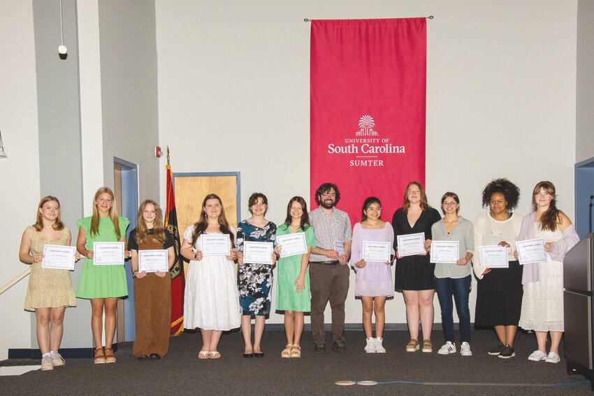 PHOTO PROVIDED  USC Sumter Instructor of English Vincent Frontero, center, stands with the finalists of the 2024 USC Sumter Spring Poetry Contest.