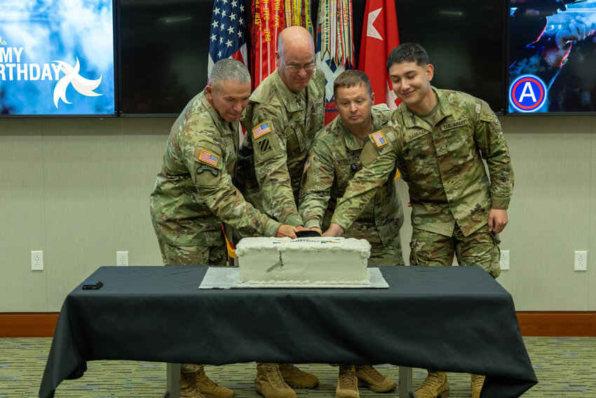From left, U.S. Army Central&rsquo;s oldest soldier, Col. Felix Perez, deputy chief of staff, cuts the Army&rsquo;s 249th Birthday cake with Maj. Gen. Henry S. Dixon, U.S. Army Central's Deputy Commanding General, Command Sgt. Maj. Jonathan Haynsworth, the senior enlisted advisor for Headquarters and Headquarters Battalion, and U.S. Army Central&rsquo;s youngest soldier, Pfc. Isaias Barraza, at Patton Hall on Shaw Air Force Base on Friday, June 14, 2024. U.S. Army Central held a traditional cake cutting ceremony with the youngest and oldest soldiers present in honor of the Army&rsquo;s 249th Birthday.