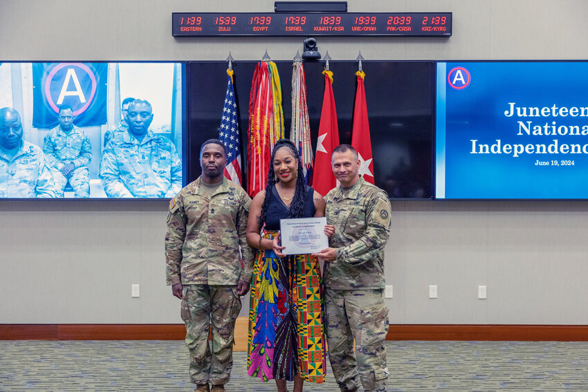 Col. Sidney Knox, U.S. Army Central&rsquo;s Deputy Chief of Staff (left), and Sgt. Maj. Kevin Rainey, U.S. Army Central G6 senior enlisted advisor (right), present Ms. LeDejia Bittle (center) with a certificate of appreciation at Patton Hall on Shaw Air Force Base, S.C., June 18, 2024. Bittle was the soloist for the Juneteenth Observance at U.S. Army Central.