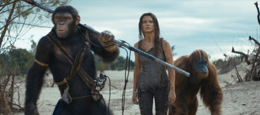 This image released by 20th Century Studios shows Noa, played by Owen Teague, from left, Freya Allan as Nova, and Raka, played by Peter Macon, in a scene from &quot;Kingdom of the Planet of the Apes.&quot;