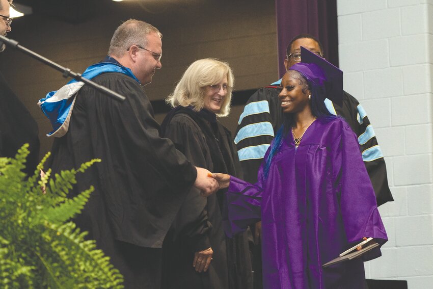 Lauren Williams walks across the stage as Sumter School District celebrates new graduates from its three high schools and adult education program on Thursday night, July 25, during 2024 summer commencement at Crestwood High School.