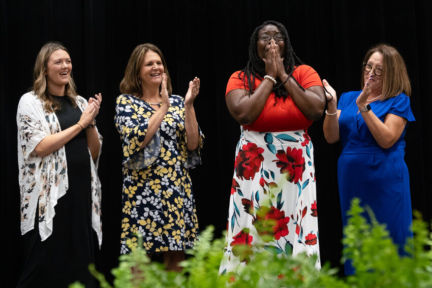 Terri Johnson, a math education interventionist at Cherryvale Elementary School, reacts to winning the District Teacher of the Year award during Sumter School District's annual Back to School rally at Sumter County Civic Center the morning of Tuesday, July 30.