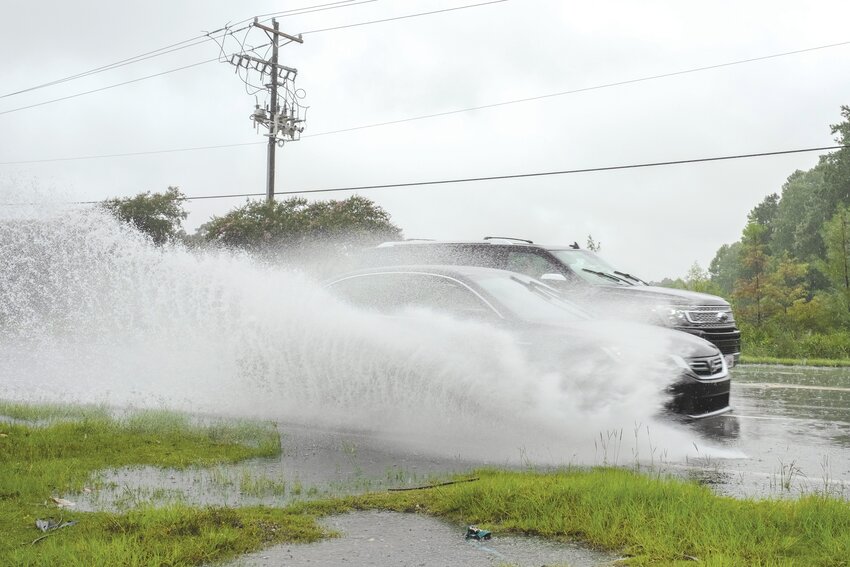 Drivers travel down Liberty Street near Second Mill on Tuesday, Aug. 6, as Tropical Storm Debby started to affect the Sumter area.