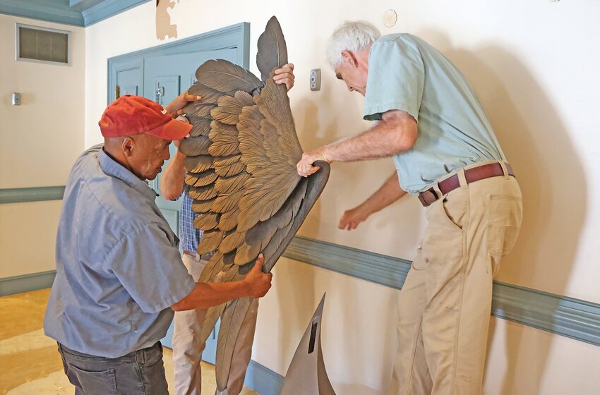 From left, William &quot;Bubba&quot; Prince, Paul Beaty and Grainger McKoy disassemble McKoy's &quot;Recovery&quot; from the lobby of Patriot Hall.