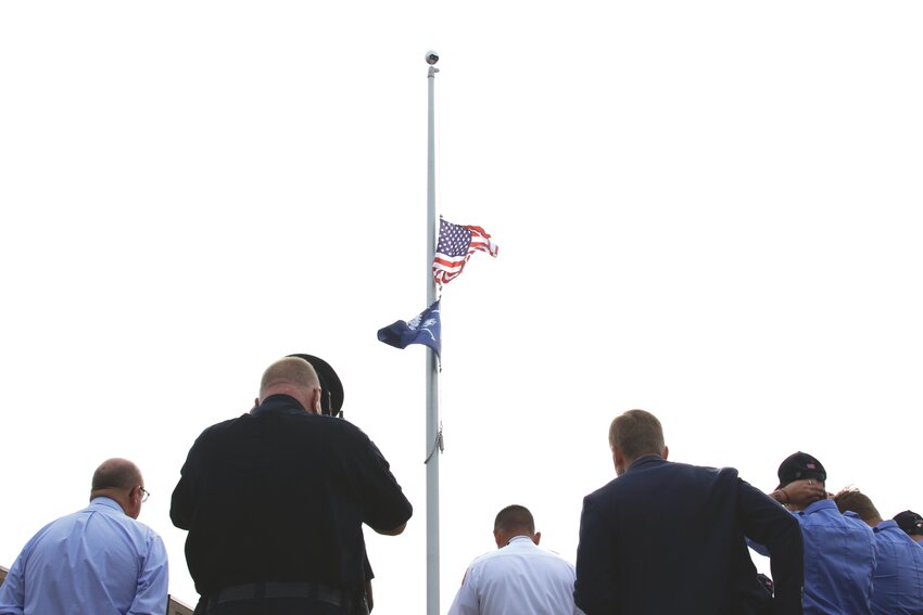 Sumter Fire Department and Sumter Police Department personnel met at the flagpole between the two headquarters for a moment of silence and prayer in honor of the lives lost during the terrorist attacks on the United States on Sept. 11, 2001. See more photos from the day's local tributes on A8. To read about Manning's Remember &amp; Honor Patriot Day Service, see page A10.     ALAYSHA MAPLE / THE SUMTER ITEM