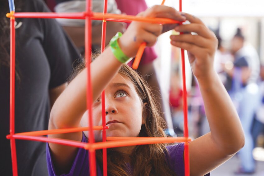 A guest builds a tower at the eSTEAM Festival in 2023. This year's event will return on Saturday, Oct. 5, in downtown Sumter.