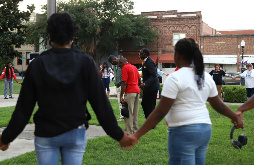 Nearly 50 Sumter residents of all backgrounds gather before the steps of the Old Sumter County Courthouse on Sept. 18 to pray for peace following the increase in gun violence. Bishop Marvin Hodge Sr. of Nation Full Gospel Ministry, Pastor James Goodman of ALIVE Praise and Worship Ministry and Bishop Harry Clark of Mt. Calvary Missionary Baptist Church led heartfelt prayers for the city.