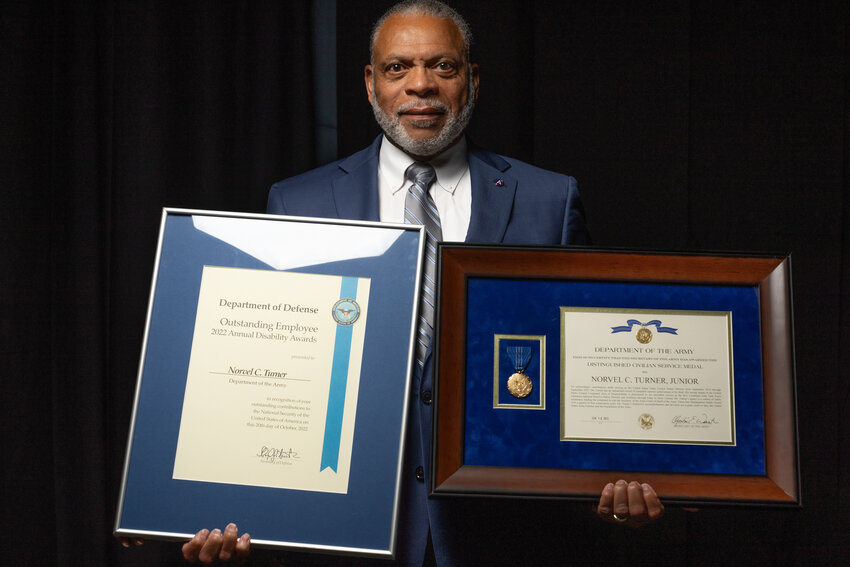 Norvel C. Turner Jr., U.S. Army Central Safety Director, reflects on his career while holding his Department of Defense Outstanding Employee with a Disability Award and Distinguished Civilian Service Medal at Patton Hall, Shaw Air Force Base, on Sept. 11. Turner has devoted over five decades to enhancing the safety of Soldiers and civilians.