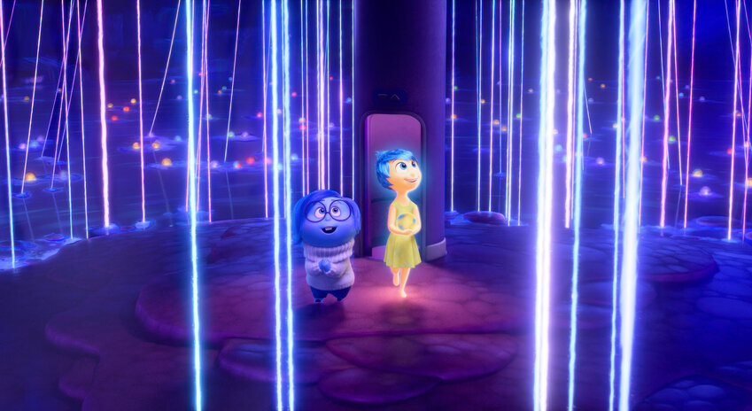 This image released by Disney/Pixar shows, from left, Sadness, voiced by Phyllis Smith, left, and Joy, voiced by Amy Poehler, in a scene from &quot;Inside Out 2.&quot;