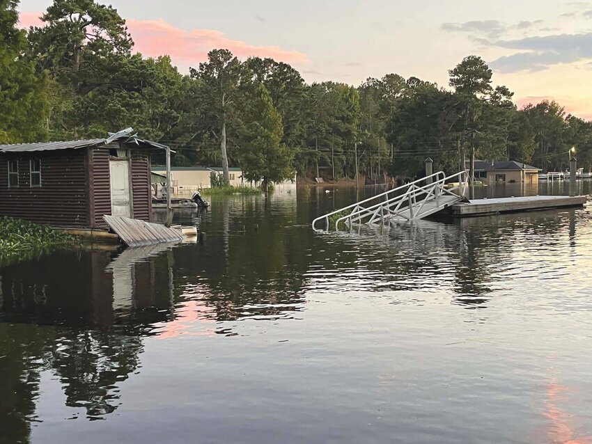 Water surrounds buildings and a ramp at Pack's Landing this past week.