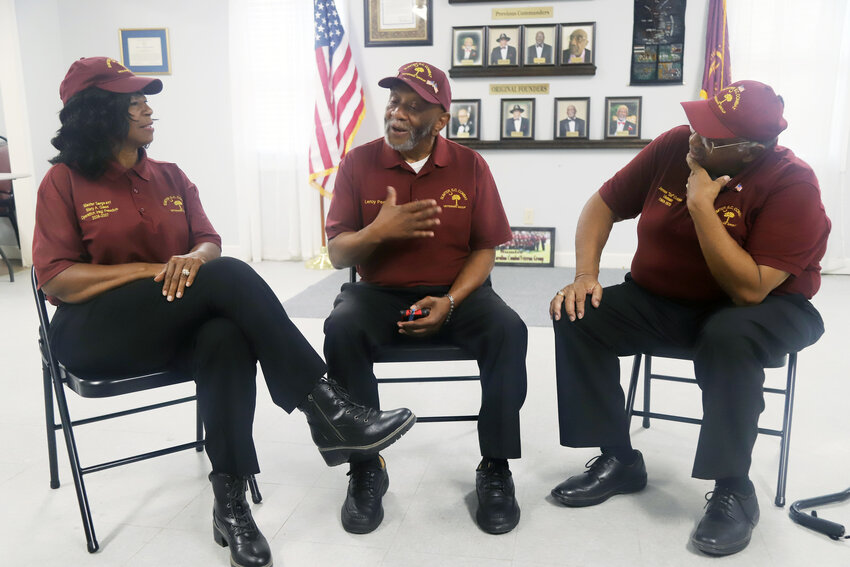 From left, Sumter, SC Combat Veterans Group Commander Mary Glass, founding member Leroy Peoples and Executive Commander &quot;Sol&quot; Golden discuss the charity's mission and service opportunities recently at the group's headquarters at 529 N. Wise Drive.