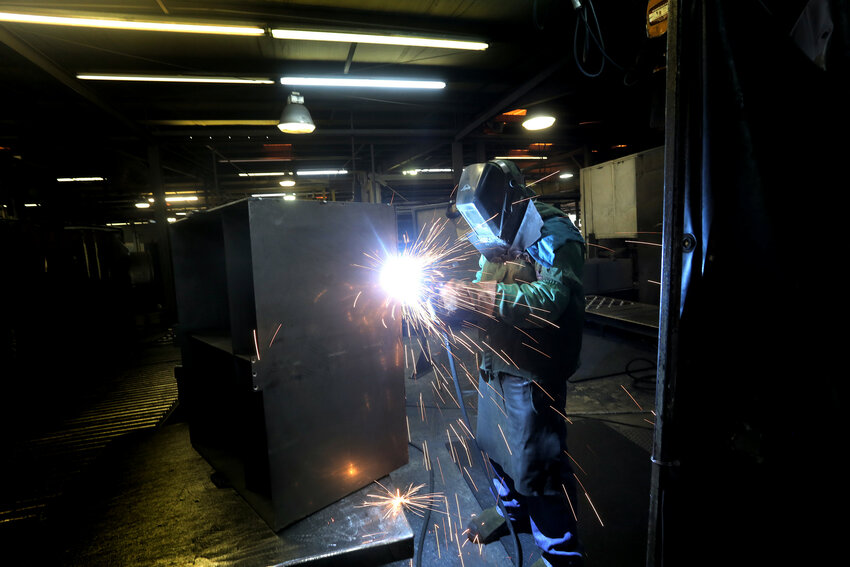 EnerSys welder Bryant Dukes works on a case that will house the battery for a forklift in 2014. The company announced an expansion of its Sumter facility that will add 14 jobs and 34,000 feet.