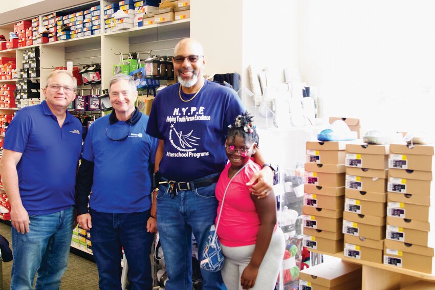 The Rotary Club of Sumter - Gamecock City, in collaboration with the H.Y.P.E After School Program and Sumter Shoe Department, provided the vouchers to children as part of the annual Happy Feet shoe donation.