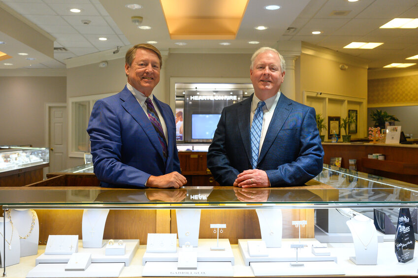Danny Chandler and Britton Moseley, co-owners, stand for a portrait inside Galloway and Moseley Jewelers on Monday, April 7, 2025. Galloway and Moseley celebrates 90 years of business in 2025. 