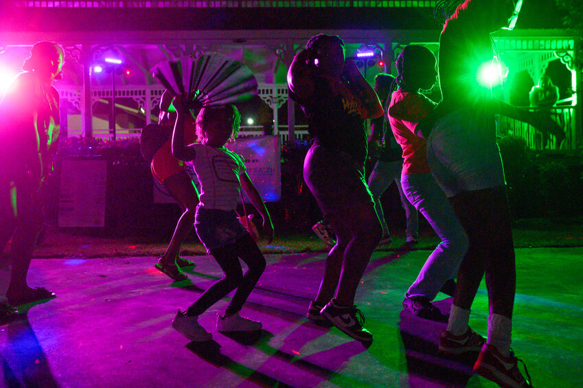 Delilah Amos, 6, left, line dances to music.